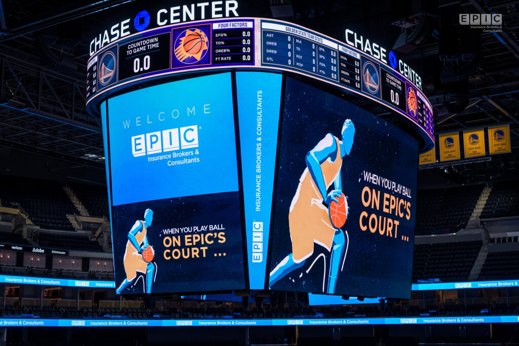 Interior of Chase Center with a large scoreboard displaying a welcome message to EPIC Insurance Brokers & Consultants.